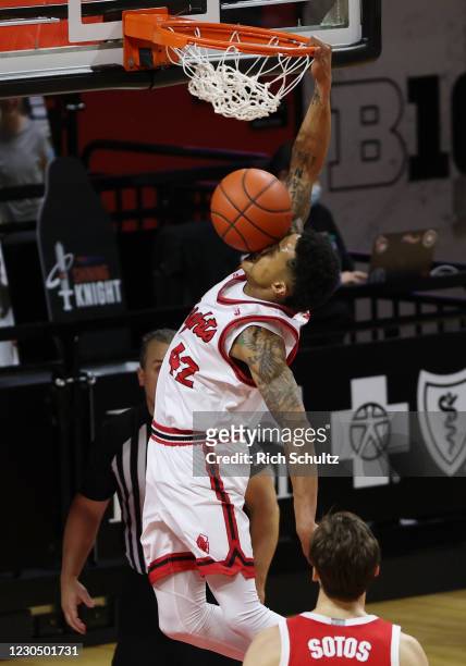 Jacob Young of the Rutgers Scarlet Knights is hit in the face by the ball as he dunks against the Ohio State Buckeyes during the second half of a...