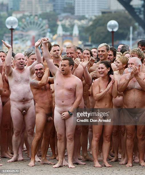 Image contains nudity.) Television reporter Grant Denyer and other nude members of the public take part in "Mardi Gras: The Base", an art...