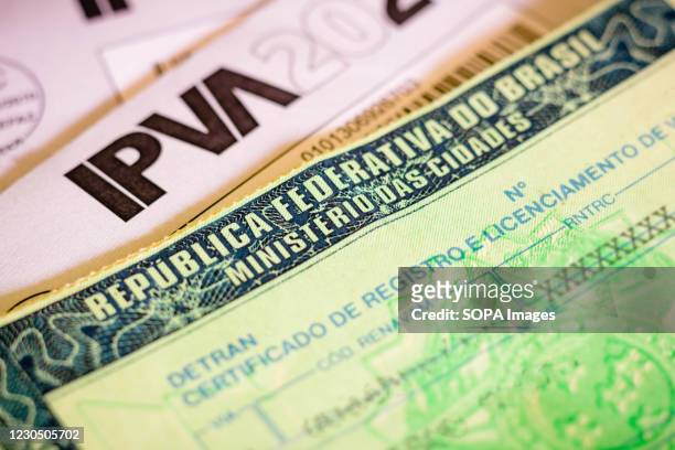 In this photo illustration the vehicle registration and licensing certificate . It is the document issued annually to indicate that the car is able...
