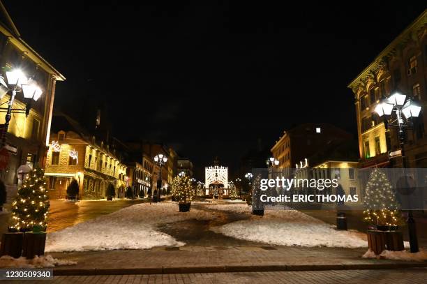 Square Jacques-Cartier, near the Old Port, which usually attracts tourists, is pictured deserted moments after the curfew was implemented from 8pm...