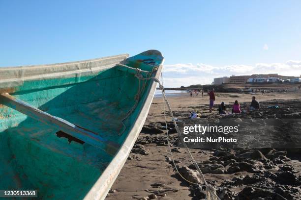 People at the beach, sunbathing and swimming are seen on Cabezo Beach, El Medano, Tenerife, Spain, on January 9, 2021. Migrants arrived at 5 of...