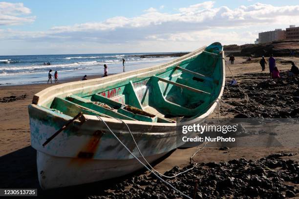 People at the beach, sunbathing and swimming are seen on Cabezo Beach, El Medano, Tenerife, Spain, on January 9, 2021. Migrants arrived at 5 of...