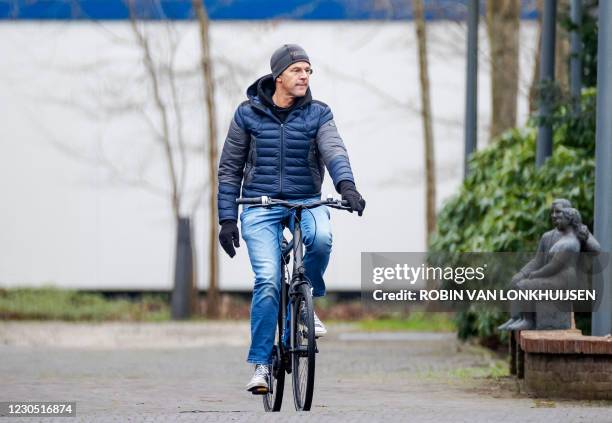 Dutch Prime Minister Mark Rutte arrives on his bicycle at the Catshuis for consultations on measures against the novel coronavirus, Covid-19, in The...