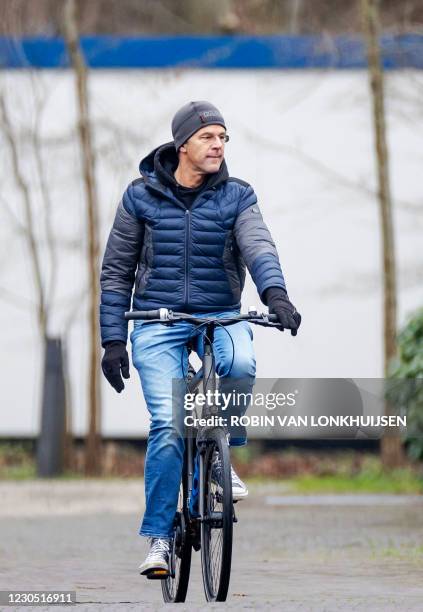 Dutch Prime Minister Mark Rutte arrives on his bicycle at the Catshuis for consultations on measures against the novel coronavirus, Covid-19, in The...