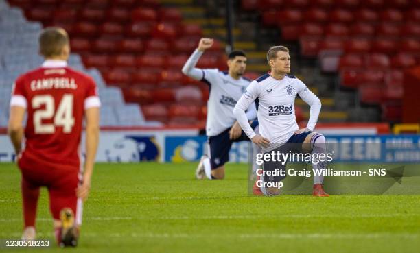 Rangers and Aberdeen's players take the knee pre match in support of the Black Lives Matter campaign against racism during a Scottish Premiership...