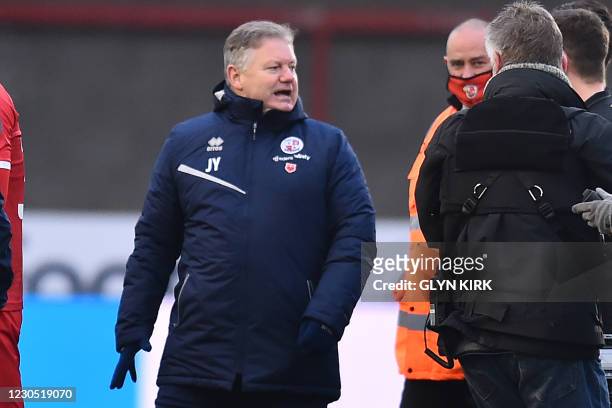 Crawley Town's English manager John Yems celebrates on the pitch after the English FA Cup third round football match between Crawley Town and Leeds...