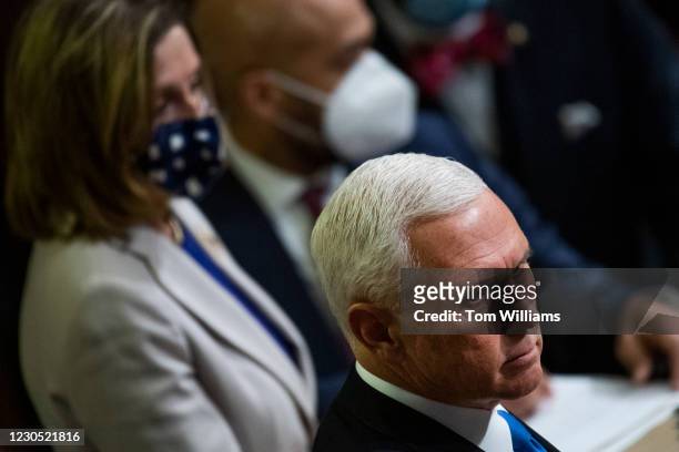 Vice President Mike Pence, and Speaker of the House Nancy Pelosi, D-Calif., are seen during a joint session of Congress in the House chamber to...