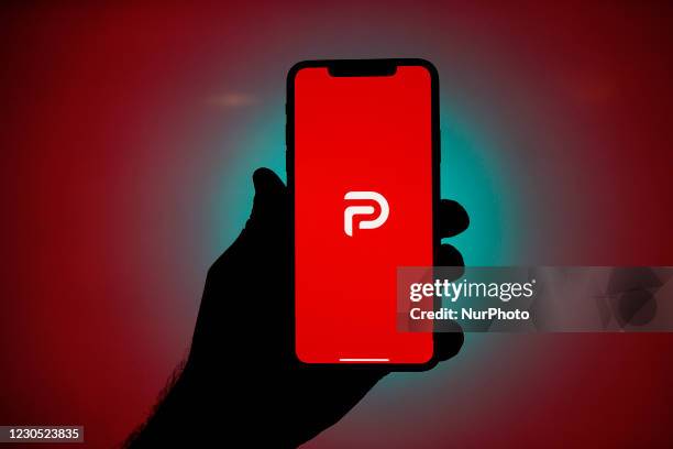 The Parler logo is seen on an Apple iPhone in this photo illustration in Warsaw, Poland on January 10, 2021. The Parler app, developed as an...