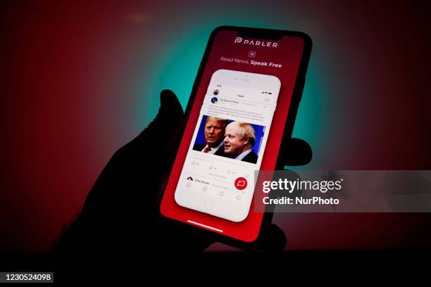 Screenshots of the Parler app from the App Store are seen on an Apple iPhone in this photo illustration in Warsaw, Poland on January 10, 2021. The...