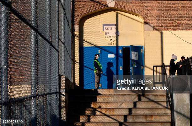 Worker waits for patients to receive dose of the Moderna coronavirus vaccine at a vaccination site at South Bronx Educational Campus, in the Bronx...