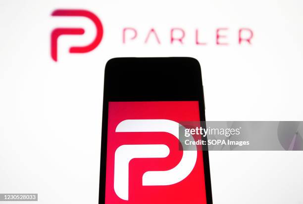 In this photo illustration the Parler logo seen displayed on a smartphone. Google, Apple and Amazon have suspended the social networking app Parler....