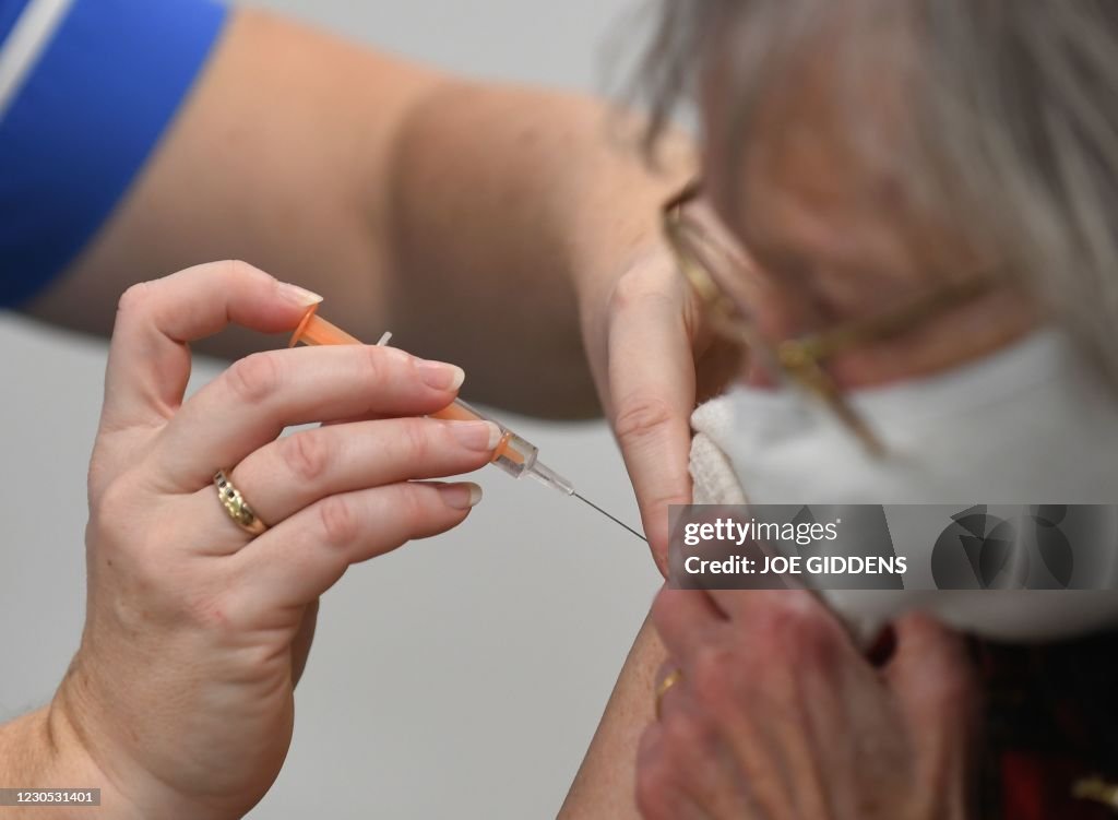 Brition Injection Heather Gallagher receives an injection of Covid-19 vaccine at a mass ...