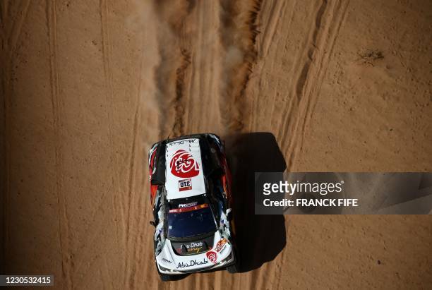 Peugeot's driver Khalid Sheikh al-Qassimi of Saudi Arabia and co-driver Xavier Panseri of France compete during stage 8 of the Dakar Rally 2021...