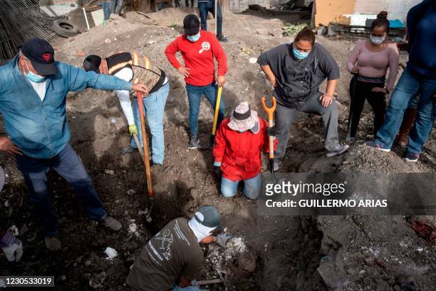 The skull of a body is seen after members of a group searching for missing people dug at a yard of a house located on the Maclovio Rojas area in...