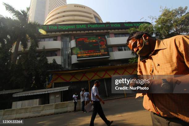 People walk past the Bombay Stock Exchange building in Mumbai, India on 11, January 2021.