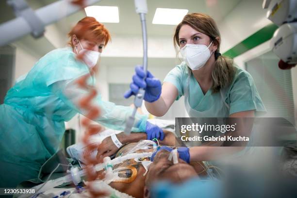 Healthcare workers take care of a post-covid patient in the ICU ward at Hospital Karvina-Raj on January 11, 2020 in Karvina, Czech Republic. The...