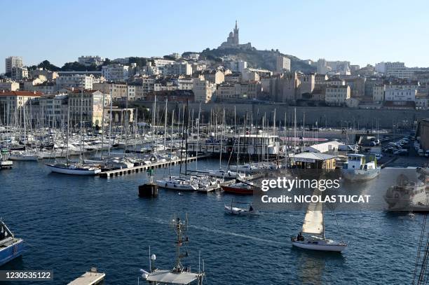 Boat sails in the Vieux-Port in Marseille, southern France, on January 11, 2021 amid the Covid-19 pandemic caused by the novel coronavirus. - France...