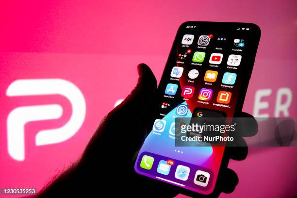 The Parler logo is seen on an Apple iPhone in this photo illustration in Warsaw, Poland on January 11, 2021. The Parler app, developed as an...