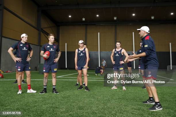 Adem Yze, Assistant Coach of the Demons speaks to a group of players during the Melbourne Demons training session at Casey Fields on January 12, 2021...