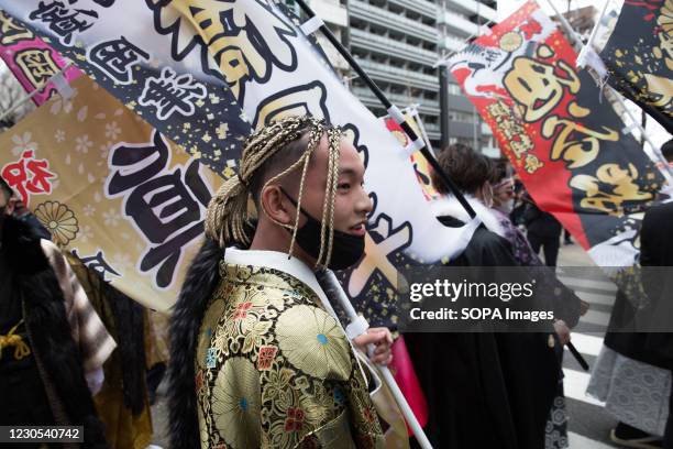 Participant of the Coming of Age ceremony seen holding a banner in Yokohama. The Coming of Age ceremony is an important Japanese traditional holiday...