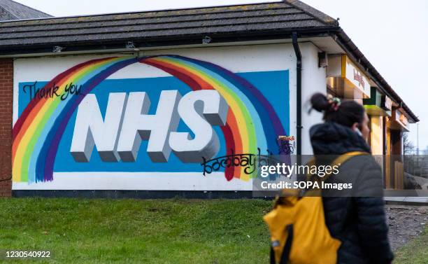 Graffiti to say thank you to NHS is seen on a street in Wales. Due to rising levels of covid infection - and the high prevalence of a more infectious...