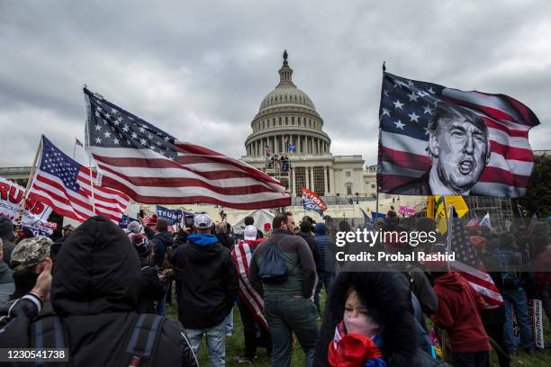 President Donald Trump's supporters gather outside the Capitol building. Pro-Trump rioters stormed the US Capitol as lawmakers were set to sign off...