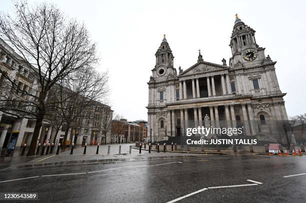 St Paul's cathedral stands deserted in central London as Britain is in its third lockdown due to the coronavirus on January 12, 2021. - People who...