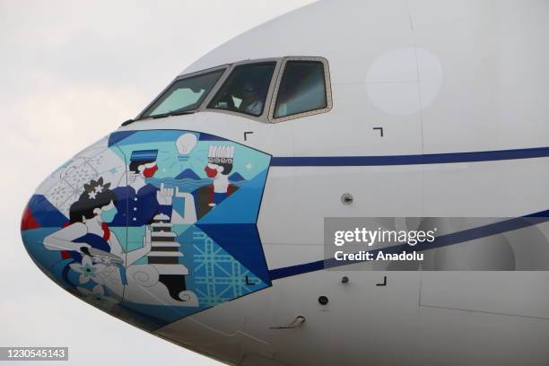 Cargo plane belonging to the Garuda Indonesia Airlines airline carrying the Covid-19 vaccine Sinovac from China is seen at Soekarno-Hatta...