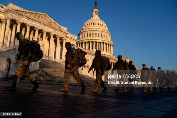 Members of the National Guard gather outside the U.S. Capitol on January 12, 2021 in Washington, DC. Today the House of Representatives plans to vote...