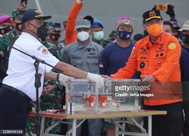 Indonesian search and rescue team release the blackbox of Sriwijaya Air flight SJ182 on a desk, after it was recovered from waters off Jakarta, at...