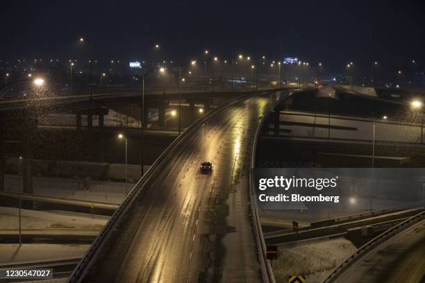 Vehicle drives on the Turcot Interchange, a three-level freeway linking highways 15 and 720, during curfew hours in Montreal, Quebec, Canada, on...