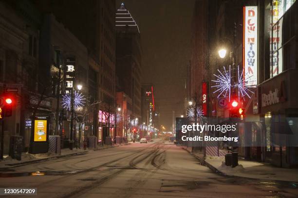 Stores on an empty St. Catherine Street during curfew hours in Montreal, Quebec, Canada, on Monday, Jan. 11, 2021.Quebec has implemented a curfew,...