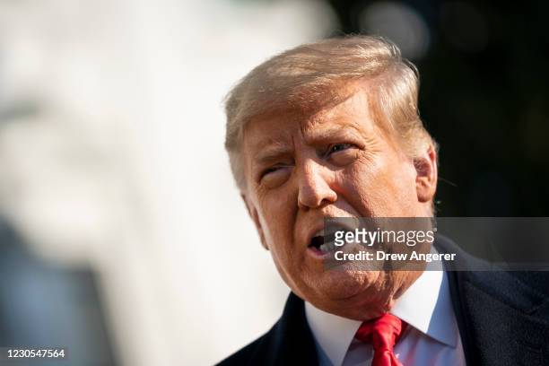 President Donald Trump speaks to reporters on the South Lawn of the White House before boarding Marine One on January 12, 2021 in Washington, DC....