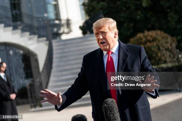 President Donald Trump speaks to reporters on the South Lawn of the White House before boarding Marine One on January 12, 2021 in Washington, DC....