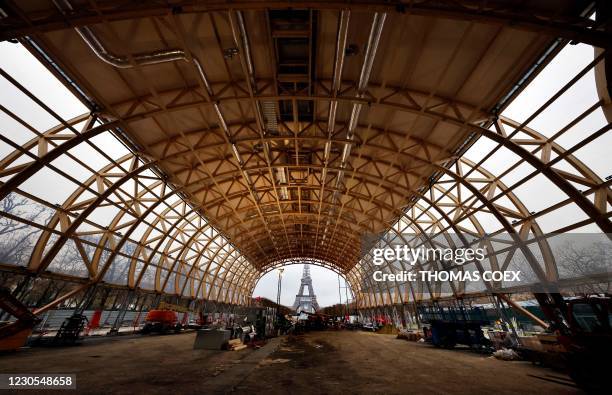 This view taken on January 12, 2021 in Paris shows the under construction temporary Grand Palais, near the Eiffel tower, designed as a replacement of...