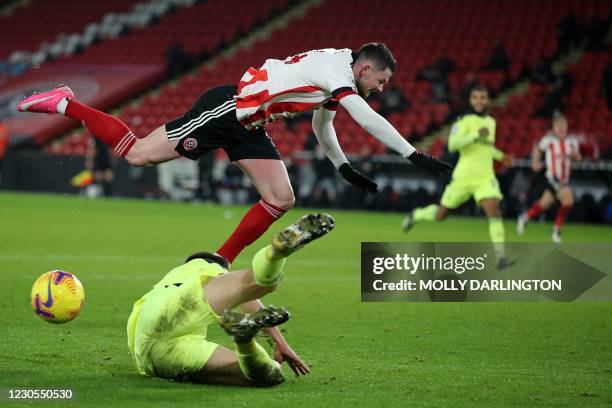 Newcastle United's Argentinian defender Federico Fernandez clasehes with Sheffield United's Scottish striker Oliver Burke during the English Premier...