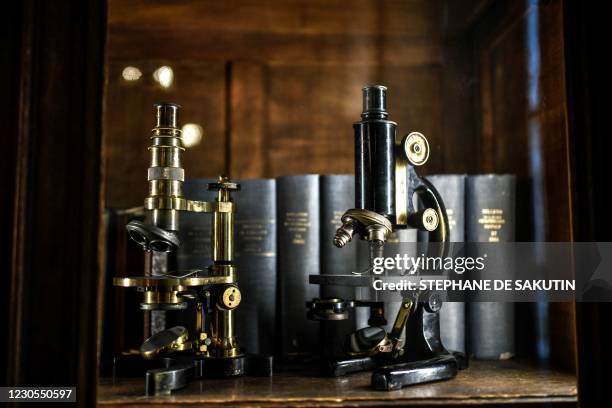 Picture taken on December 22, 2020 shows microscopes displayed at "La Salle des Actes", a reception room of the French scientist Louis Pasteur at the...