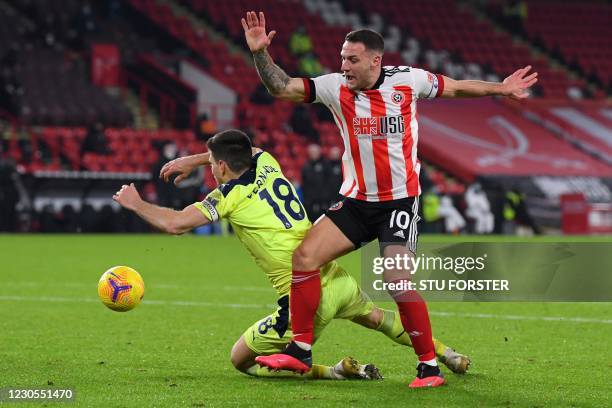 Newcastle United's Argentinian defender Federico Fernandez fouls Sheffield United's English striker Billy Sharp to concede a penalty during the...