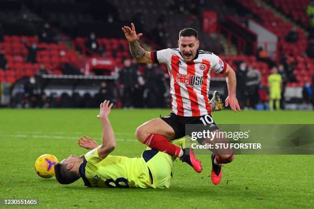 Newcastle United's Argentinian defender Federico Fernandez fouls Sheffield United's English striker Billy Sharp to concede a penalty during the...