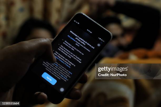 Whatsapp privacy policy terms message flashes on a mobile phone screen in Baramulla, Jammu and Kashmir India on 12 January 2021