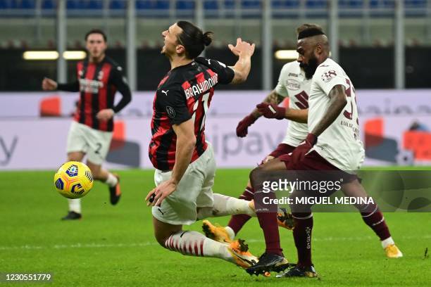 Torino's Cameroon defender Nicolas Nkoulou tackles AC Milan's Swedish forward Zlatan Ibrahimovic during the Italian Cup round of sixteen football...