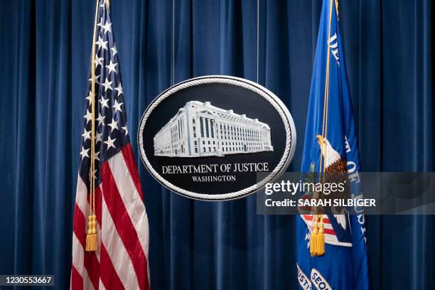 Sign for the Department of Justice is seen ahead of a news conference with Michael Sherwin, acting US attorney for the District of Columbia, and...