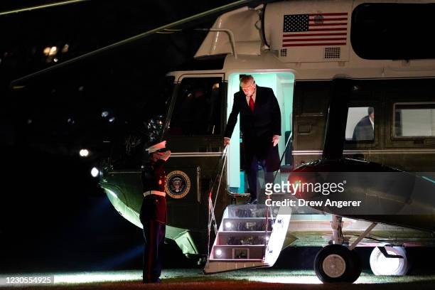 President Donald Trump exits Marine One as he returns to the White House on January 12, 2021 in Washington, DC. Following last week's deadly...