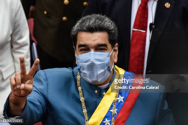 President of Venezuela Nicolas Maduro makes the victory sign as he arrives to give the State of The Nation Report 'Memoria y Cuenta 2020' at Palacio...