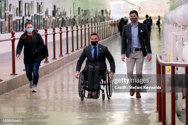 Rep. Madison Cawthorn wears a protective mask while going to the U.S. Capitol on January 12, 2021 in Washington, DC. Today the House of...