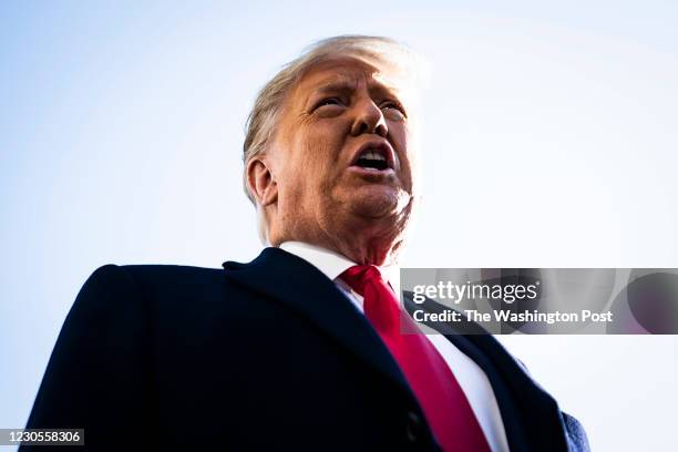 President Donald J. Trump stops to talk to reporters as he walks to board Marine One and depart from the South Lawn at the White House on Tuesday,...