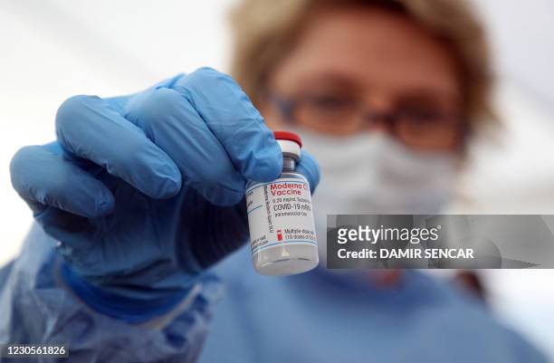 Medical worker shows a dose of the Moderna Covid-19 vaccine, in a Red Cros medical tent in Petrinja, some 50 kilometres from Zagreb, on January 13...