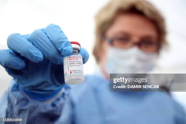 Medical worker shows a dose of the Moderna Covid-19 vaccine, in a Red Cros medical tent in Petrinja, some 50 kilometres from Zagreb, on January 13...