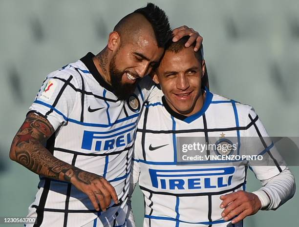 Inter Milan's Chilean midfielder Arturo Vidal celebrates with Inter Milan's Chilean forward Alexis Sanchez after opening the scoring during the...