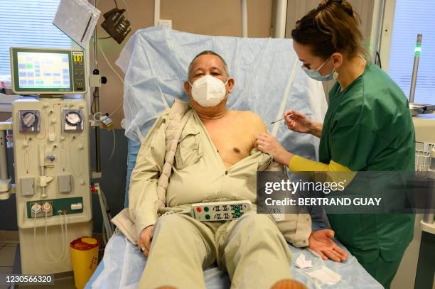 Dialysis patient receives the Pfizer-BioNTech Covid-19 vaccine in a private clinic in Aulnay-sous-Bois, on January 13, 2021.